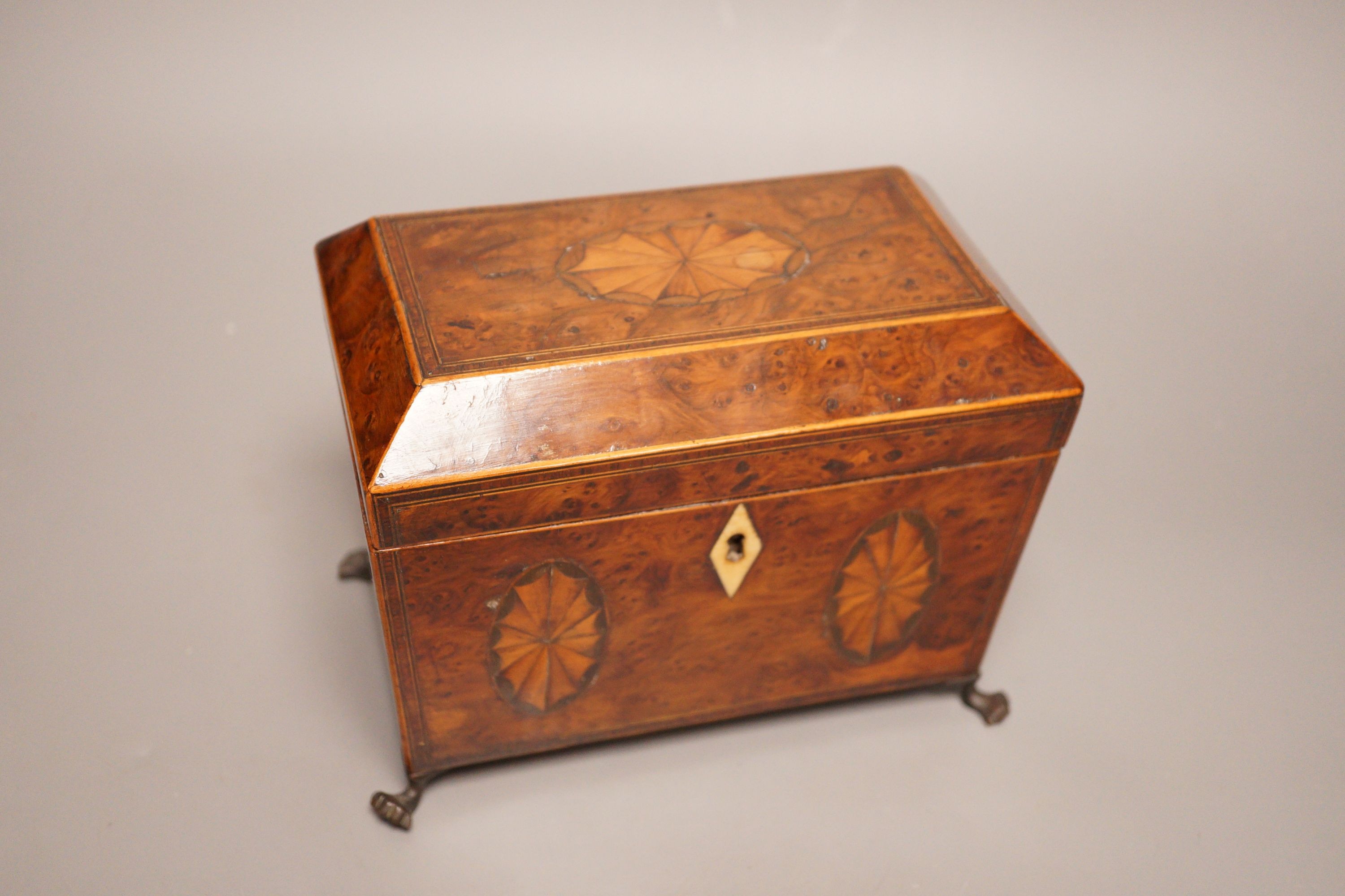 A Regency inlaid burr yew tea caddy, ivory escutcheon, 19cm foot to foot